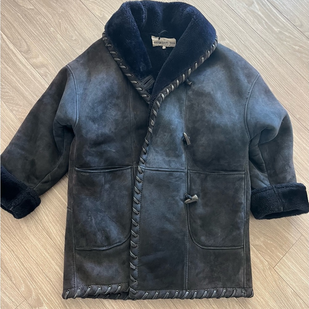 Italian suede/shearling with 2 pockets.